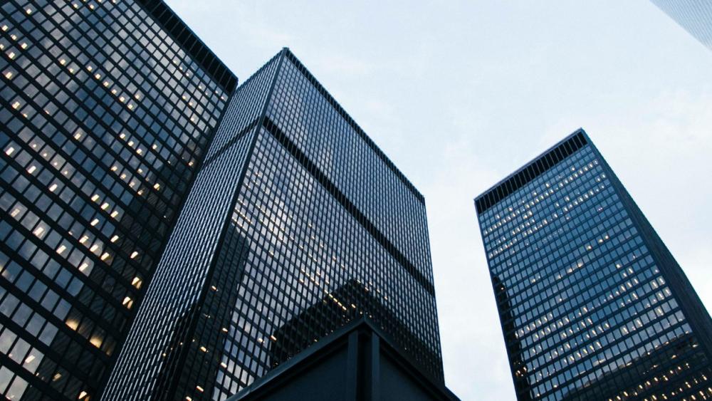 A modern city skyline featuring a range of skyscrapers.