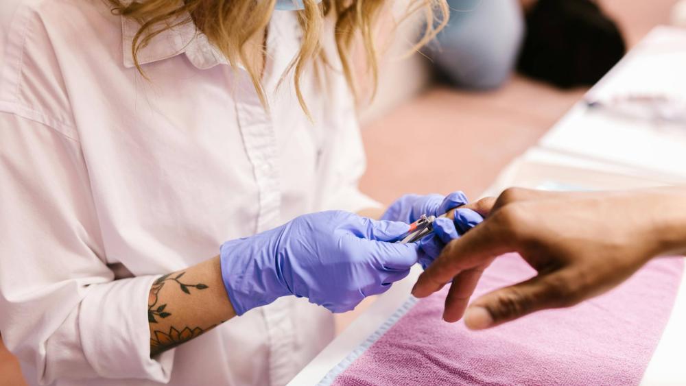 Hands in picture showing a manicure