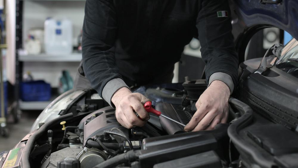mechanic working in engine