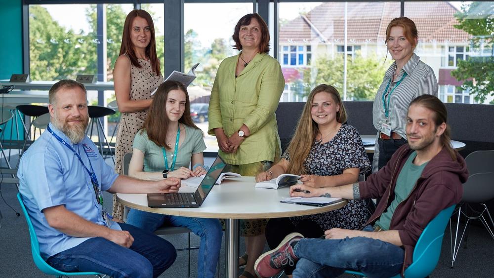 Future teachers sitting around a table