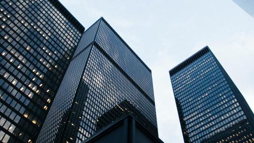 A modern city skyline featuring a range of skyscrapers. 
