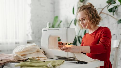 Person sitting at sewing machine