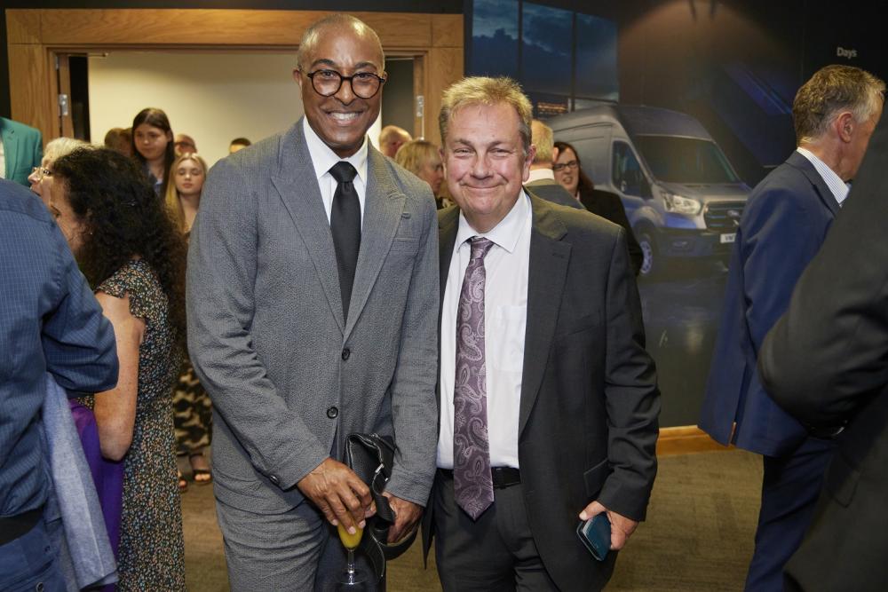 Men in smart suits, smiling